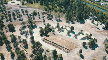 An aerial view of the whole campground showing dirt roads and trees at Soda Creek Campground in Soda Springs, Idaho.